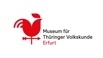 Schriftzug mit Wetterhahn in Rot und Schwarz